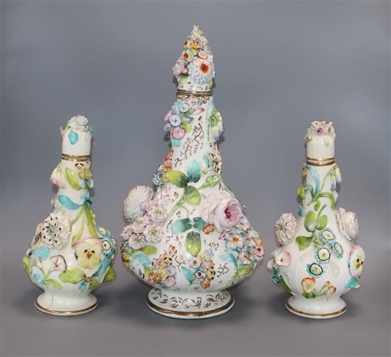 Three English porcelain flower encrusted scent bottles and covers, c. 1830-40, possibly Coalbrookdale, H. 41cm and 28cm